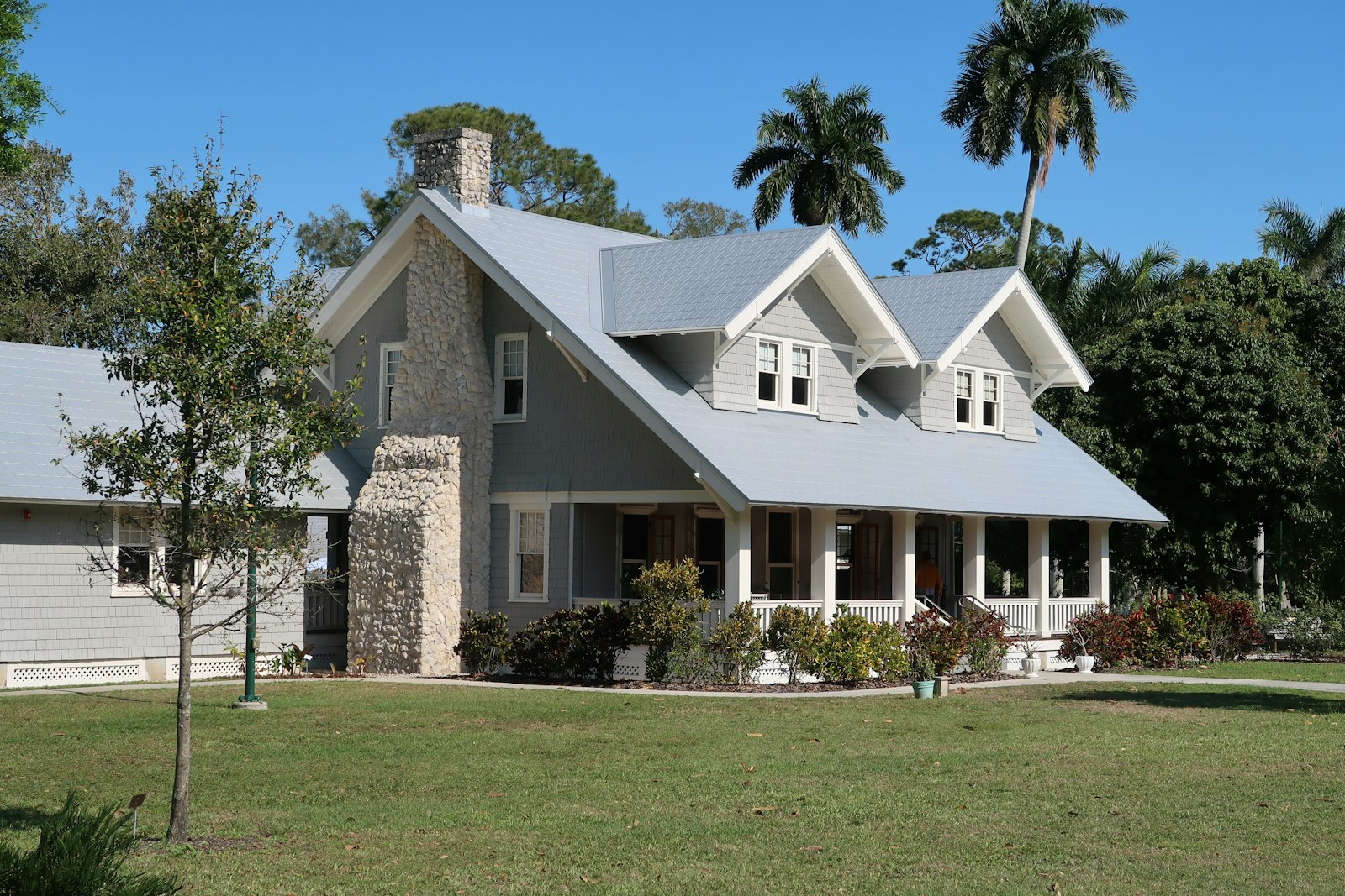 South Florida tile roof with dark algae streaks before soft wash cleaning